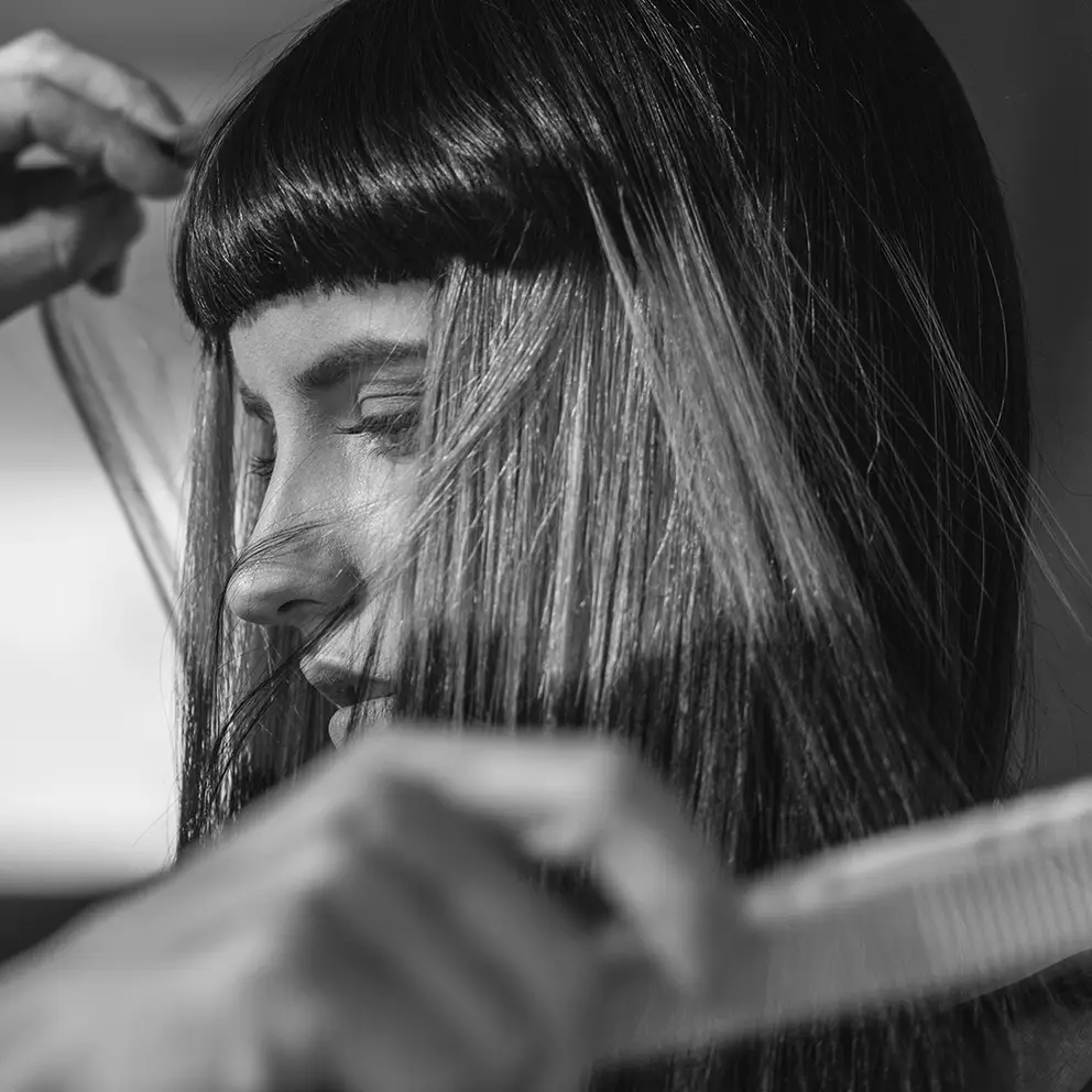 Woman styling hair